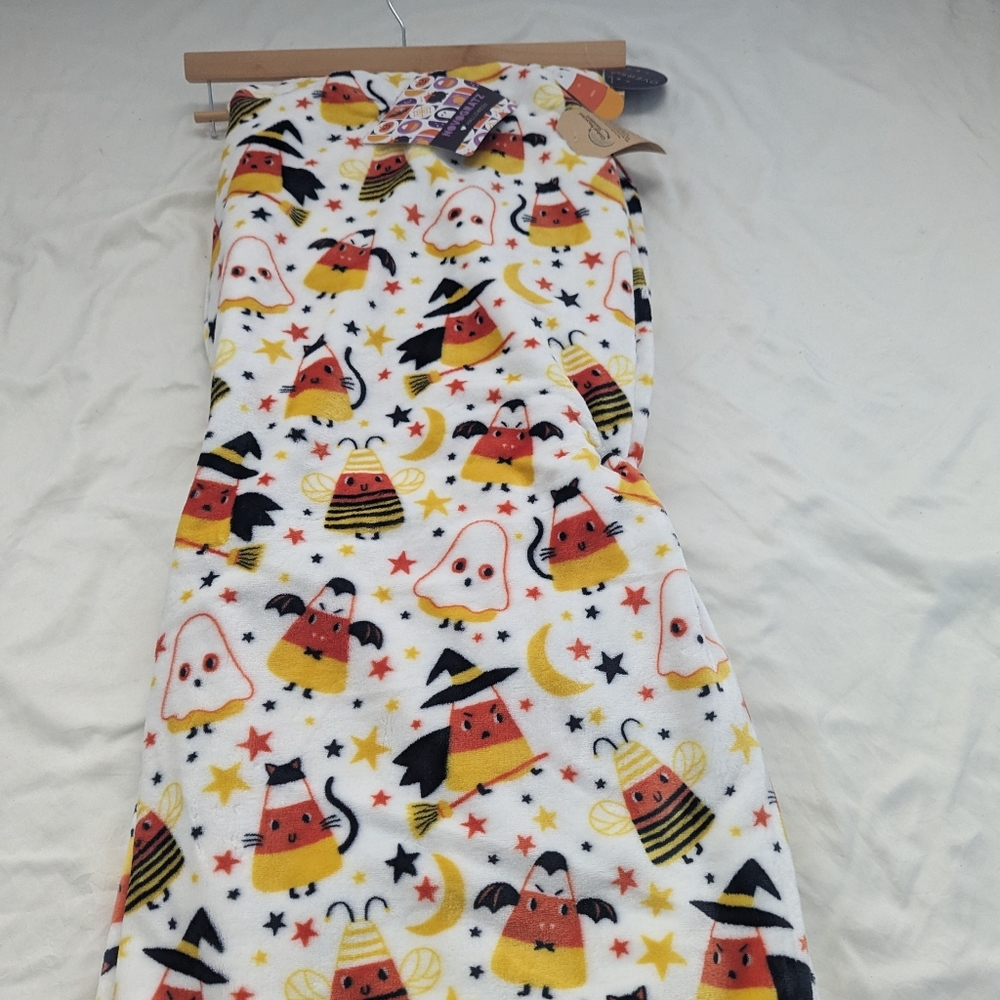 Candy corns in costumes throw blanket